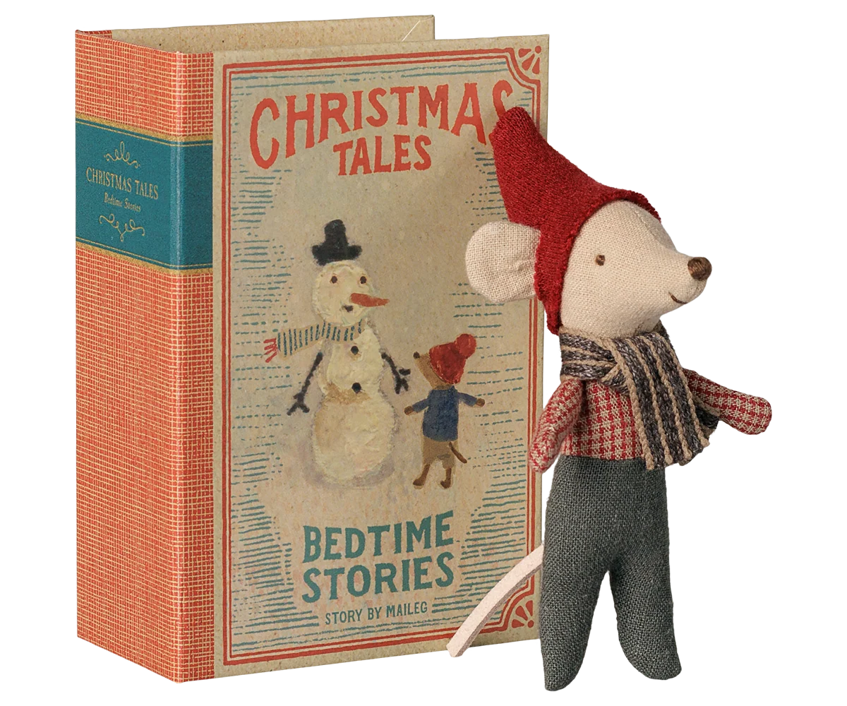 Maileg Christmas mouse beside its illustrated Christmas Tales book